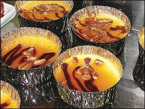 Creme brulee drizzled with chocolate and caramel sauces are among the delicious desserts made in the kitchen at Epic Buffet in Hollywood Casino.
