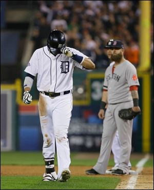 Detroit Tigers' Victor Martinez leaves for a pinch runner after hitting a single in the ninth inning.