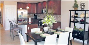 This lovely island kitchen is open to the dining area. Both are open to the great room. 