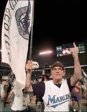 Manager Jim Leyland celebrates on the field after the Florida Marlins defeated the Indians 3-2 in Game Seven of the World Series in 1997. It was his only World Series title.