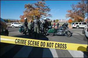 Police secure the scene near Sparks Middle School after a shooting in Sparks, Nev. today.  Authorities are reporting that two people were killed and two wounded at the Nevada middle school.