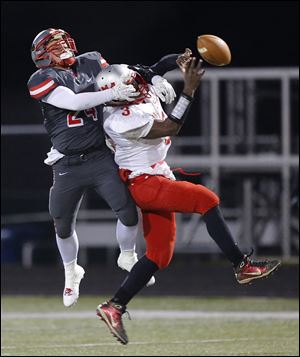 Central's Derich Weiland, left, breaks up a pass intended for Lima Senior's Marquis Graham during the second quarter. Weiland also played a big role on offense, scoring the Irish's first touchdown.