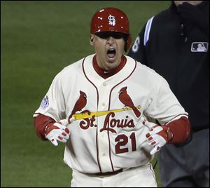 St. Louis Cardinals' Allen Craig reacts after hitting a double during the ninth inning Saturday night in Boston.