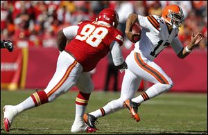 Cleveland Browns quarterback Jason Campbell (17) gets around Kansas City Chiefs defensive tackle Anthony Toribio (98) Sunday.