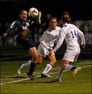 Notre Dame's Dani Johnson kicks the ball during Div. 1 girls soccer regional semifinal at Lake High School in Millbury, Ohio.