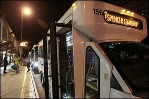 A Spencer Township-bound TARTA bus awaits riders in downtown Toledo.