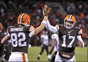 Browns quarterback Jason Campbell, right,  celebrates with tight end Gary Barnidge after they hooked up on a 4-yard touchdown pass against the Baltimore Ravens in the third quarter Sunday in Cleveland.