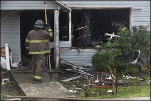 A deadly fire in East Toledo apparently began on the first floor in a living room hallway on Saturday.