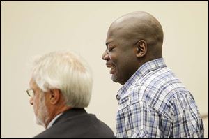 Michael Yates, right, with attorney Jon Richardson, cries as a Judge Myron Duhart announces his sentence in Common Pleas Court.