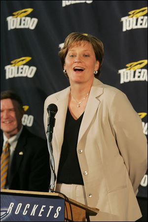 UT athletic director Mike O'Brien, left, listens as Tricia Cullop speaks to the media at her introduction on April 18, 2008. 