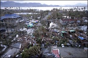 Tacloban Airport is covered by debris after powerful Typhoon Haiyan hit Tacloban city, in Leyte province today in central Philippines.