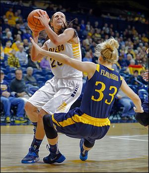 Toledo’s Stephanie Recker, left, runs into Drexel’s Fiona Flanagan during the first half of their Glass City Tournament contest.