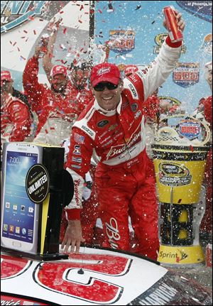 Kevin Harvick celebrates in victory lane after winning the AdvoCare 500 NASCAR Sprint Cup Series race Sunday at Phoenix International Raceway in Avondale, Ariz.