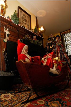 St. Nicholas with toys in a sled from the late 1800s.