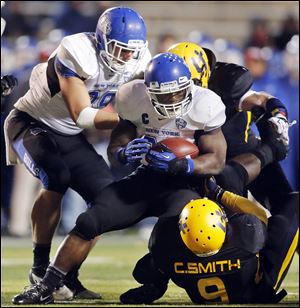 Buffalo’s Branden Oliver is stopped by UT defensive end Christian Smith.