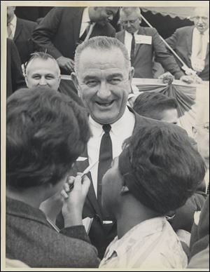 Lyndon Johnson visited with a crowd in Toledo in late September, 1963. After becoming president two months later, Mr. Johnson said, 'I want to come down very hard on civil rights, not because Kennedy was for it but because I am for it.'