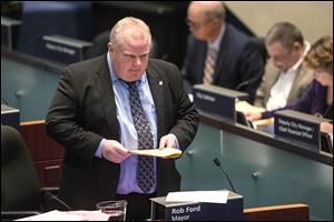 Toronto Mayor Rob Ford stands in the council chamber in Toronto on Friday. 