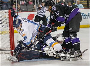 Toledo's Martin Frk (19), gets tangled in a web of Reading players after scoring against Royals goalie Riley Gill to tie the teams at 1 in the first period. The Royals went on to score 3 in the first frame.