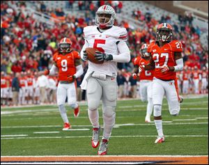 Ohio State quarterback Braxton Miller (5) scores on a 70-yard touchdown run as Illinois defensive back Eaton Spence (27) and defensive back Earnest Thomas III (9) chase him on Saturday.