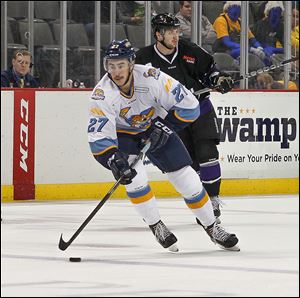 Trevor Parkes drives to the goal with a Reading player in pursuit on Sunday.