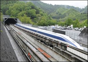 The Maglev (magnetic levitation) train speeds during a test run on the experimental track in Tsuru, 100km west of Tokyo.