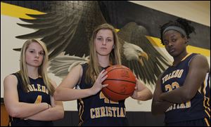 Toledo Christian finished 20-4 last season and looks to repeat as Toldeo Area Athletic Conference champion with top players, from left, Darian Westmeyer, Faith Johnson, and Camille Gist.