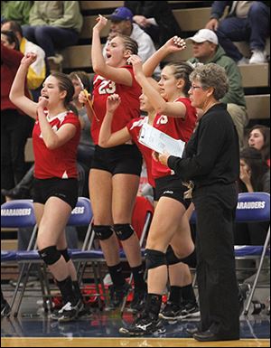 Bedford head coach Jodi Manore remains calm as her bench reacts to a point.