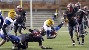 Clyde’s Damian Coburn makes a catch against Central Catholic during a Division III regional final. The Fliers pulled off the big upset by continually answering the Irish’s scores.