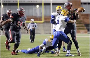 Central Catholic’s DeShone Kizer fumbles the ball after being hit by Clyde linebacker Jake Jenne with less than a minute to go.