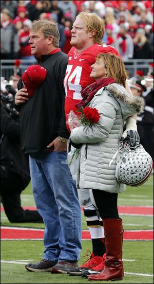 Ohio State senior Jack Mewhort (74) with his parents, Don and Gail Mewhort, before the game against Indiana.