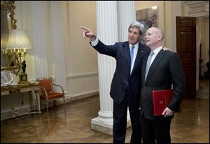 U.S. Secretary of State John Kerry, left, talks with British Foreign Secretary William Hague at the residence of the U.S. Ambassador to Britain, in London. Mr. Kerry arrived in the U.K. after two days of talks in Geneva.