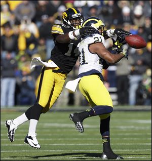 Iowa defensive back Desmond King, left, breaks up a pass intended for Michigan wide receiver Jeremy Gallon during the second half , Saturday.