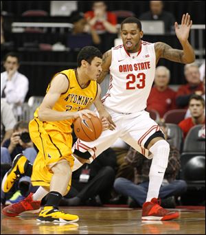 Ohio State's Amir Williams (23) guards Wyoming's Lary Nance, Jr. (22) during the first half of an NCAA college basketball game, Monday, Nov. 25, 2013, in Columbus, Ohio. (AP Photo/Mike Munden)