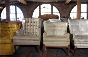 Hundreds of chairs and sofas of different styles and time periods line the ‘road kill’ floor at Sit On It... A Chair Gallery in the West Bottoms district in Kansas City, Mo.