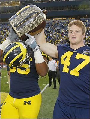 Jake Ryan, right, scoffs at the notion that Ohio State is going to roll in the latest battle between the rivals.