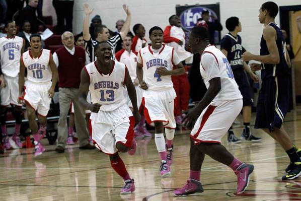 Bowsher-s-Dajuan-King-13-celebrates-his-game-winning-3-pointer