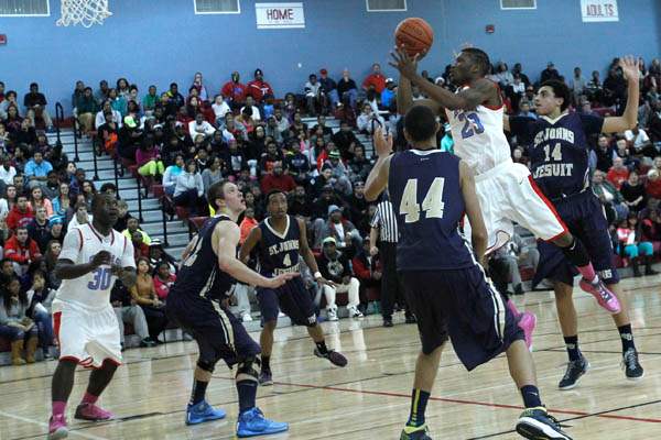 Bowsher-s-Nate-Allen-shoots-between-St-Johns-defenders