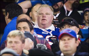 Toronto Mayor Rob Ford watches the Buffalo Bills play the Atlanta Falcons in Toronto Sunday.