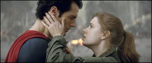 Henry Cavill as Superman, left, and Amy Adams as Lois Lane in ‘Man of Steel.’