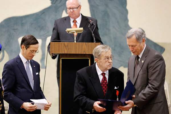 At-center-John-Turk-accepts-the-Medal-of-Knight-of-t