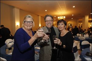 Cynthia Sippel, left, Randy Lake, center, and Janna Lake, right, enjoy the Kidney Foundation of Northwest Ohio's wine event at the Parkway Place.