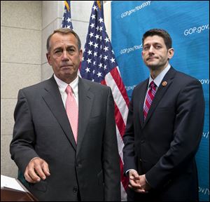 House Speaker John Boehner of Ohio, left,  joined by House Budget Committee Chairman Rep. Paul Ryan, R-Wis., takes reporters' questions, on Capitol Hill in Washington, today.