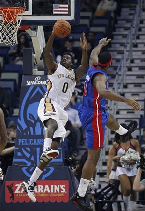 New Orleans Pelicans small forward Al-Farouq Aminu (0) drives to the basket past Detroit Pistons center Andre Drummond in the first half.