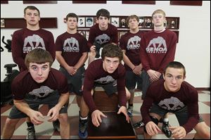 Genoa seeks a Northern Buckeye Conference championshp with top wrestlers (front, from left) Jay Nino, Damian D'Emilio, and Brandon Bates, and (back, from left) Tyler Baird, Nathan Moore, Max Reeder, Cody Buckner, and Dustin Widmer. 