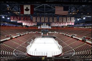 Championship banners and retired numbers of the Detroit Red Wings hockey team hang from the rafters above the ice at Joe Louis Arena in Detroit. 
