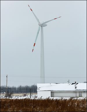 A 325-foot wind turbine at Lake Erie Business Park in Ottawa County is close to Camp Perry, where the federal government is to fund a planned 198-foot tower.