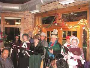 The Toledo Rep’s choir, the Dickens Singers, sing at the theatre’s fund-raiser.