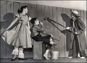 Judy Wood, Steve Balch, and Lex Yougman, as Becky, Tom Sawyer, and Huck Finn, in 1957 photo of Tom Sawyer, presented by Children's Theatre Workshop.