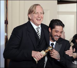T Bone Burnett, left, who collaborated with Justin Timberlake on the  comic tune ‘Please Mr. Kennedy,’ won a Golden Globe Award in 2010 with Ryan Bing-ham for ‘Crazy Heart.’