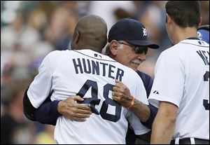 Torii Hunter hugs Tigers manager Jim Leyland after hitting a game-winning single. Leyland, 69, retired after 22 seasons as a manager, the final eight with Detroit.